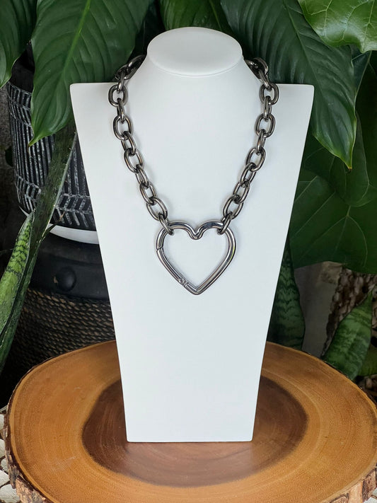 a shiny metal heart necklace